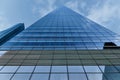 Skyscraper. Sunset sky is reflected in glass facade. Modern building Royalty Free Stock Photo