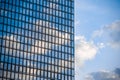 Skyscraper windows close up with blue sky reflection Royalty Free Stock Photo