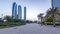 Skyscrapers of Abu Dhabi with Etihad Towers buildings day to night timelapse. Royalty Free Stock Photo