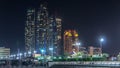 Skyscrapers of Abu Dhabi at night with Etihad Towers buildings . Royalty Free Stock Photo