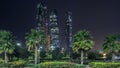 Skyscrapers of Abu Dhabi at night with Etihad Towers buildings . Royalty Free Stock Photo