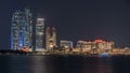 Skyscrapers of Abu Dhabi at night with Etihad Towers buildings timelapse. Royalty Free Stock Photo