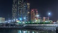 Skyscrapers of Abu Dhabi at night with Etihad Towers buildings timelapse. Royalty Free Stock Photo