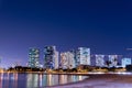 Skyscrapers on the beach of Waikiki in Honolulu, Hawaii at night Royalty Free Stock Photo