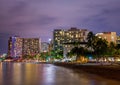 Skyscrapers on the beach of Waikiki in Honolulu, Hawaii at night Royalty Free Stock Photo
