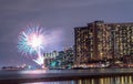 Skyscrapers on the beach of Waikiki in Honolulu, Hawaii at night with splendid fireworks Royalty Free Stock Photo