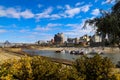 Skyscrapers and buildings in the city skyline along the water in Wolf Creek Harbor with red and white steam boats docked Royalty Free Stock Photo