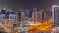 Skyscrapers at the Business Bay in Dubai aerial day to night timelapse, United Arab Emirates