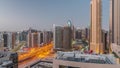 Skyscrapers at the Business Bay in Dubai aerial night to day timelapse, United Arab Emirates