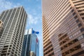 Skyscrapers in the city of Calgary with Alberta and Canadian flags Royalty Free Stock Photo