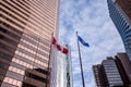 Skyscrapers in the city of Calgary with Alberta and Canadian flags Royalty Free Stock Photo