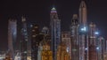 Skyscrapers of Dubai Marina near Sheikh Zayed Road with highest residential buildings all night timelapse Royalty Free Stock Photo