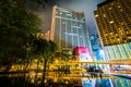 Skyscrapers and a fountain at Victoria Park at night, in Causeway Bay, Hong Kong, Hong Kong. Royalty Free Stock Photo