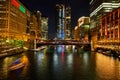 Skyscrapers light up in night life of Chicago along canals Royalty Free Stock Photo