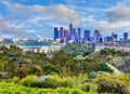 Skyscrapers of Los Angeles skyline are surrounded by green hills, CA Royalty Free Stock Photo