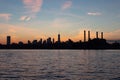 Lower Manhattan Skyline Silhouette during a Colorful Sunset along the East River in New York City Royalty Free Stock Photo