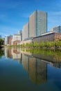 Skyscrapers of Marunouchi district reflecting in the water of Edo castle outer moat. Tokyo. Japan Royalty Free Stock Photo