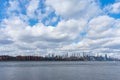 Midtown Manhattan Skyline with Beautiful Clouds along the East River in New York City Royalty Free Stock Photo