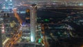 Skyscrapers and other buildings near the Dubai World Trade center district in Dubai aerial night timelapse Royalty Free Stock Photo