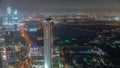 Skyscrapers and other buildings near the Dubai World Trade center district in Dubai aerial night timelapse Royalty Free Stock Photo