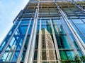 Skyscrapers are reflected in the glass facade of another skyscraper in Hong Kong China Royalty Free Stock Photo