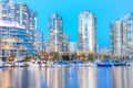 Skyscrapers reflection along False Creek riverside in Vancouver BC at blue hour Royalty Free Stock Photo