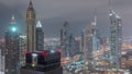 Skyscrapers on Sheikh Zayed Road and DIFC day to night timelapse in Dubai, UAE. Royalty Free Stock Photo