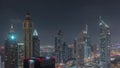 Skyscrapers on Sheikh Zayed Road and DIFC night timelapse in Dubai, UAE. Royalty Free Stock Photo