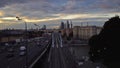 Skyscrapers, Third Ring Road and ES2G Lastochka (Swallow) trains on the Moscow Central Circle line at sunset. Time-lapse