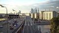 Skyscrapers, Third Ring Road and ES2G Lastochka (Swallow) trains on the Moscow Central Circle line at sunset. Time-lapse