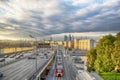 Skyscrapers, Third Ring Road and ES2G Lastochka (Swallow) trains on the Moscow Central Circle line at sunset