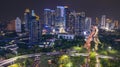 Skyscrapers with traffic jam on the road at night Royalty Free Stock Photo