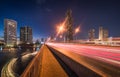 Skyscrapers and Traffic Light Trails on a Bridge Crossing a River Royalty Free Stock Photo