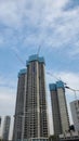 skyscrapers are under construction, there are many cranes working there. in the young city of Zhuhai, south China.