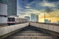 Skytrain is leaving the Ratchayothin BTS station on the Sukhumvit Line towards the blue and yellow sunset