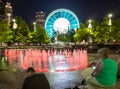 Skyview Atlanta Ferris Wheel in motion and Centennial Olympic Park Fountain. Atlanta, GA.
