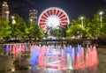 Skyview Atlanta Ferris Wheel in motion and Centennial Olympic Park Fountain. Atlanta, GA. Royalty Free Stock Photo