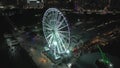 Skyview Miami ferris wheel aerial night orbit tracking shot
