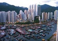 Skyview of the tall buildings and small fishing boats in Hong Kong