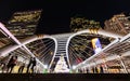 Skywalk bridge in business area decorated by christmas tree at night