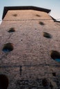 skyward tower outline, vertical perspective emphasizing warm textured bricks and evening sunlight glow Royalty Free Stock Photo