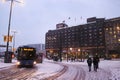 SL buses travelling through the centre of Stockholm in the thick winter snow, Stockholm, Sweden.