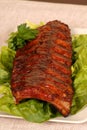 Slab of ribs on lettuce Royalty Free Stock Photo