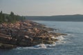 Slabs Of Pink Granite Boulders Along The Atlantic Ocean On A Misty Morning On The Maine Coast
