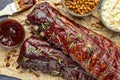 2 slabs of ribs with barbeque sauce on brown paper Royalty Free Stock Photo