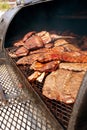 Slabs Of Ribs Cook On Grill At Barbeque Festival Royalty Free Stock Photo