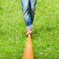 Slack line in the city park. Royalty Free Stock Photo