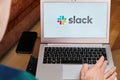 Slack is used for business meeting on laptop by man. An illustrative editorial image. San Francisco, US, June 2020 Royalty Free Stock Photo