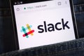 Slack website displayed on smartphone hidden in jeans pocket