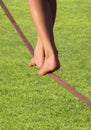 Slackline feet over grass Royalty Free Stock Photo